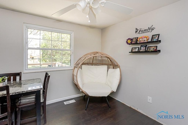 bedroom featuring wood finished floors, baseboards, and a ceiling fan