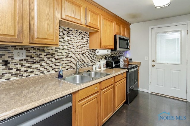 kitchen with stainless steel appliances, a sink, light countertops, backsplash, and baseboards
