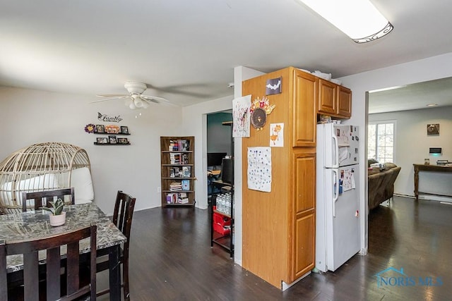 kitchen with freestanding refrigerator, dark wood-type flooring, and ceiling fan
