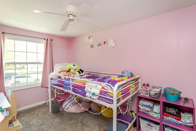 bedroom with baseboards, ceiling fan, and carpet floors