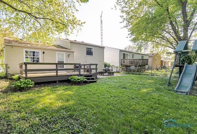 back of house featuring a deck