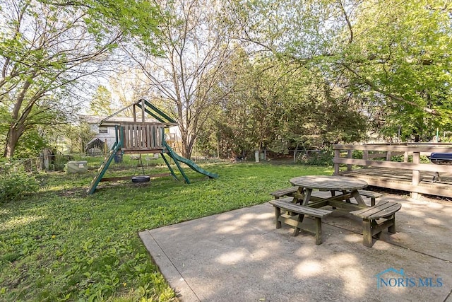 view of playground featuring a patio area