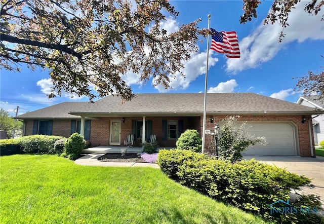 844 Sunset Dr, Findlay, OH 45840 - single story home with brick siding, a garage, a front lawn, concrete driveway, and a porch