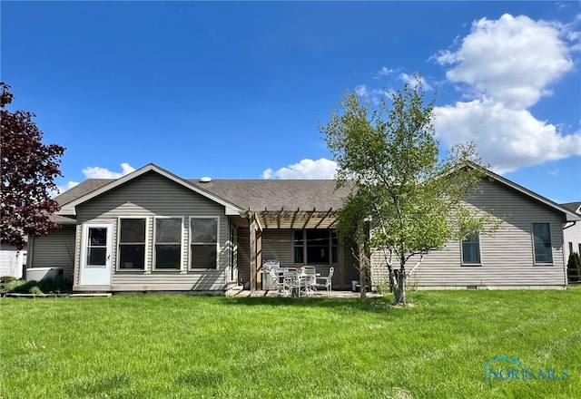 844 Sunset Dr, Findlay, OH 45840 - back of property featuring a lawn, crawl space, a patio, and a shingled roof