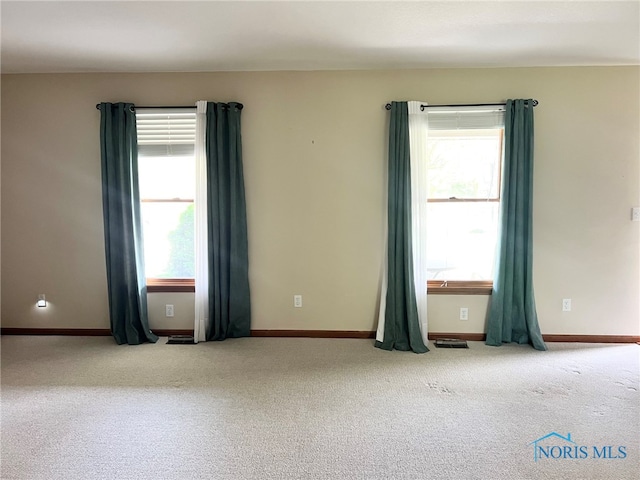 844 Sunset Dr, Findlay, OH 45840 - spare room with carpet flooring and baseboards