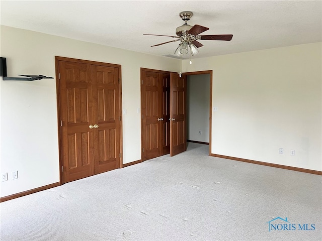 844 Sunset Dr, Findlay, OH 45840 - unfurnished bedroom with baseboards, carpet, and ceiling fan