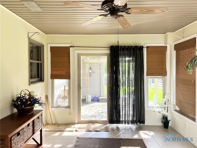 844 Sunset Dr, Findlay, OH 45840 - entryway featuring tile patterned floors, a ceiling fan, wood ceiling, and baseboards