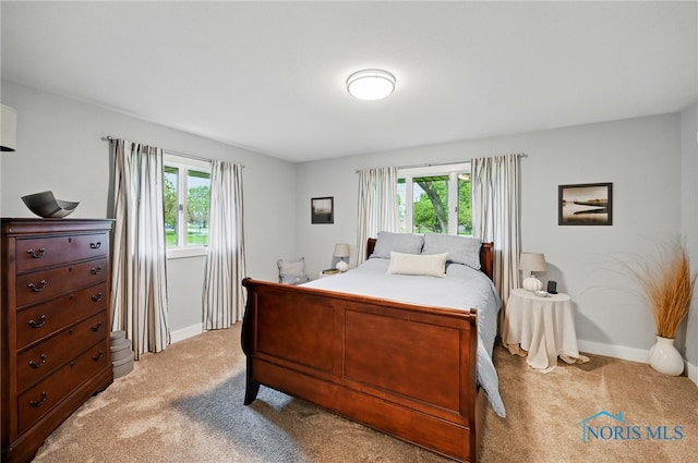 685 N Main St, Arlington, OH 45814 - bedroom featuring light carpet and baseboards