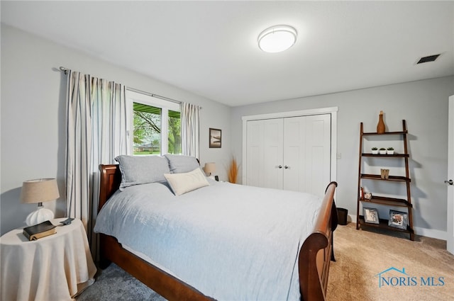 685 N Main St, Arlington, OH 45814 - bedroom with light carpet, a closet, and baseboards