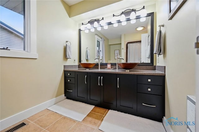 685 N Main St, Arlington, OH 45814 - full bathroom featuring tile patterned floors, baseboards, and vanity