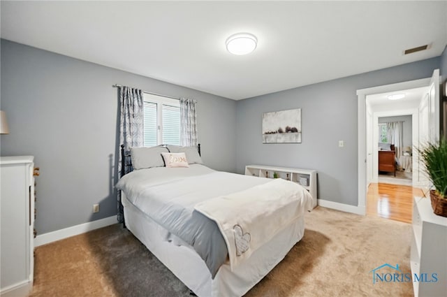 685 N Main St, Arlington, OH 45814 - carpeted bedroom featuring multiple windows and baseboards