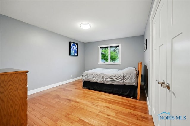 685 N Main St, Arlington, OH 45814 - bedroom with light wood-style floors and baseboards