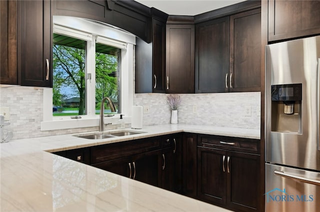685 N Main St, Arlington, OH 45814 - kitchen featuring stainless steel refrigerator with ice dispenser, a sink, and dark brown cabinetry