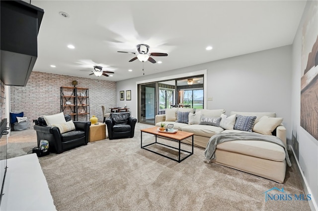 685 N Main St, Arlington, OH 45814 - living room featuring brick wall, carpet floors, ceiling fan, and recessed lighting