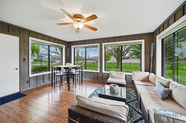 685 N Main St, Arlington, OH 45814 - sunroom with a deck, healthy amount of natural light, baseboards, and wood walls