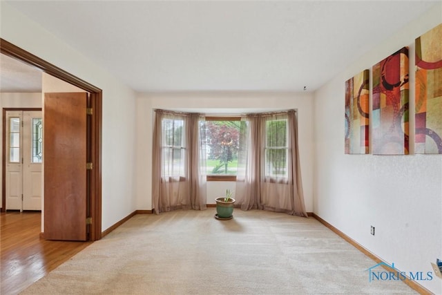 empty room with baseboards