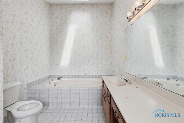 bathroom featuring wallpapered walls, vanity, a garden tub, tile patterned flooring, and toilet