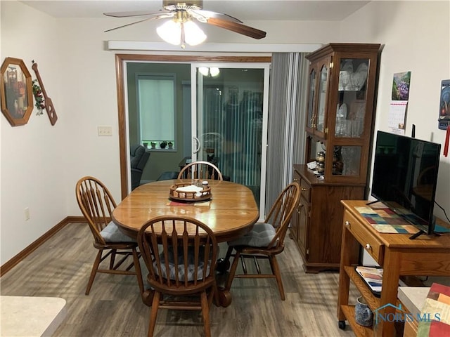 109 Rivers Edge Ln Unit C, Upper Sandusky, OH 43351 - dining room featuring ceiling fan, wood finished floors, and baseboards