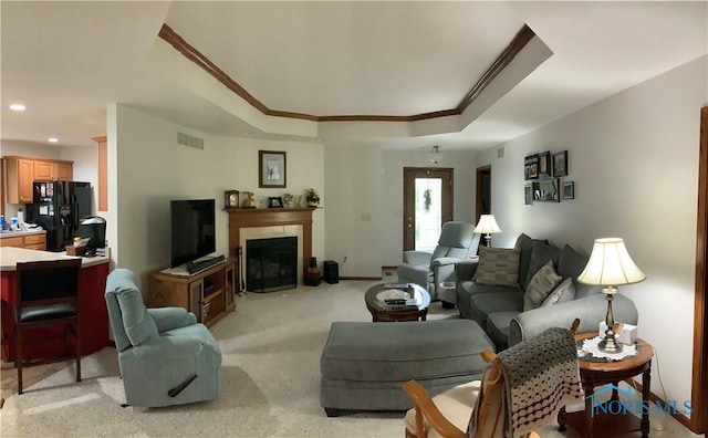 109 Rivers Edge Ln Unit C, Upper Sandusky, OH 43351 - living room featuring ornamental molding, light colored carpet, baseboards, recessed lighting, and a fireplace with flush hearth