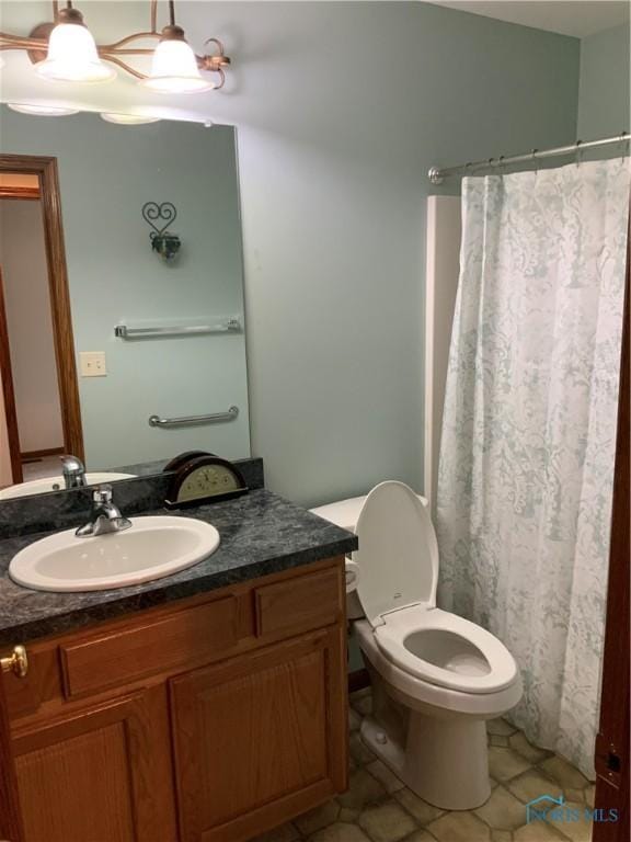 109 Rivers Edge Ln Unit C, Upper Sandusky, OH 43351 - full bathroom with toilet, vanity, tile patterned flooring, and curtained shower