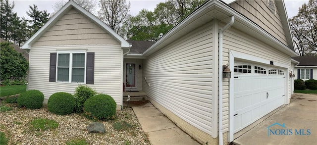 109 Rivers Edge Ln Unit C, Upper Sandusky, OH 43351 - view of front of house featuring concrete driveway and an attached garage