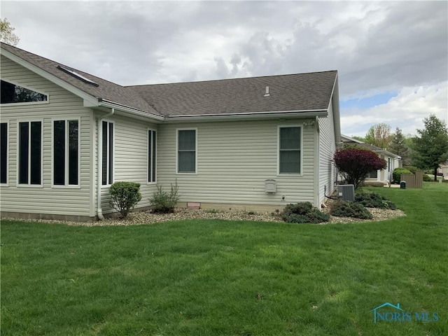 109 Rivers Edge Ln Unit C, Upper Sandusky, OH 43351 - view of side of property featuring central air condition unit, a lawn, and roof with shingles
