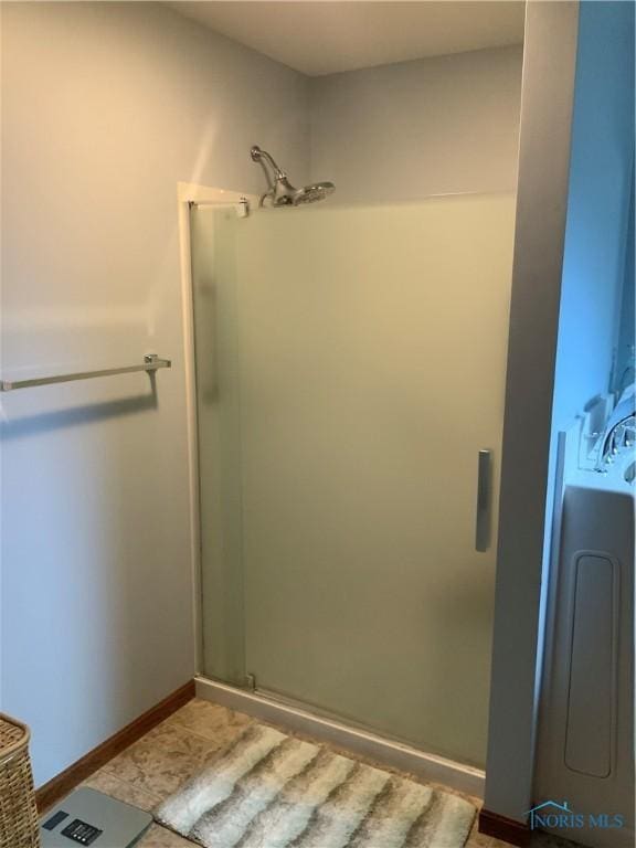 109 Rivers Edge Ln Unit C, Upper Sandusky, OH 43351 - bathroom featuring a stall shower and baseboards