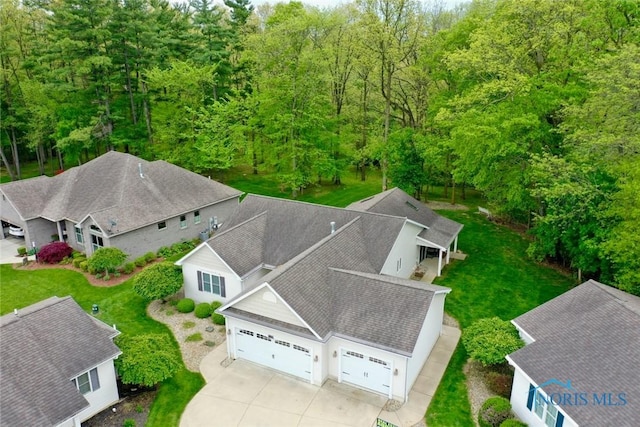 109 Rivers Edge Ln Unit C, Upper Sandusky, OH 43351 - aerial view of property and surrounding area featuring a heavily wooded area