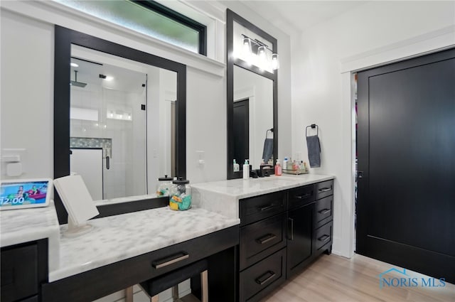 8440 E Woodland Trl, Findlay, OH 45840 - bathroom featuring a shower stall, vanity, and wood finished floors