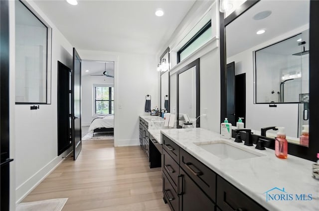 8440 E Woodland Trl, Findlay, OH 45840 - full bathroom with wood finished floors, vanity, ensuite bath, recessed lighting, and ceiling fan