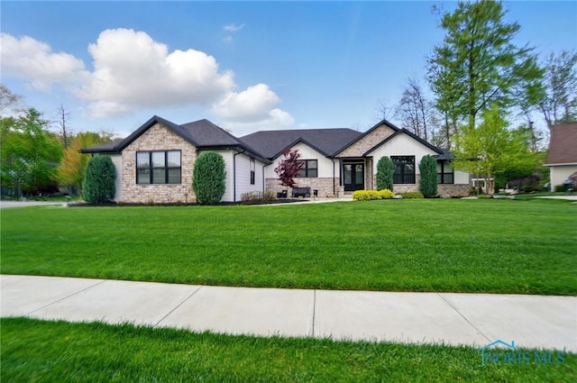8440 E Woodland Trl, Findlay, OH 45840 - view of front of home featuring stone siding and a front yard
