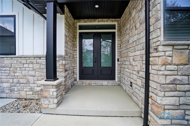 8440 E Woodland Trl, Findlay, OH 45840 - view of exterior entry with french doors and stone siding