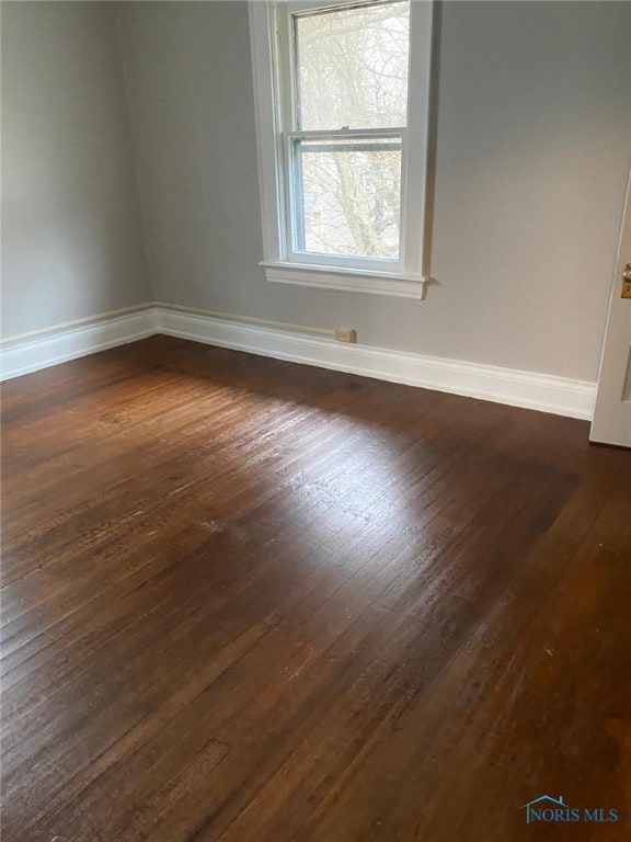 862 Prouty Ave, Toledo, OH 43609 - unfurnished room featuring dark wood-style floors and baseboards