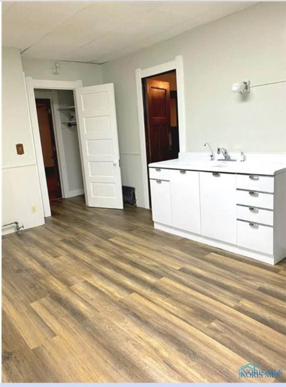 862 Prouty Ave, Toledo, OH 43609 - unfurnished bedroom featuring wood finished floors