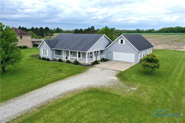 2450 N Billman Rd, Genoa, OH 43430 - single story home featuring covered porch, driveway, a front lawn, and a garage