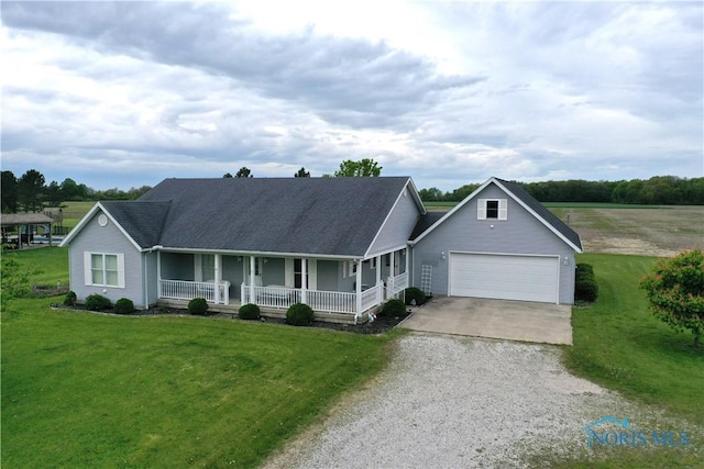 2450 N Billman Rd, Genoa, OH 43430 - view of front of house with concrete driveway, a porch, a front lawn, and an attached garage