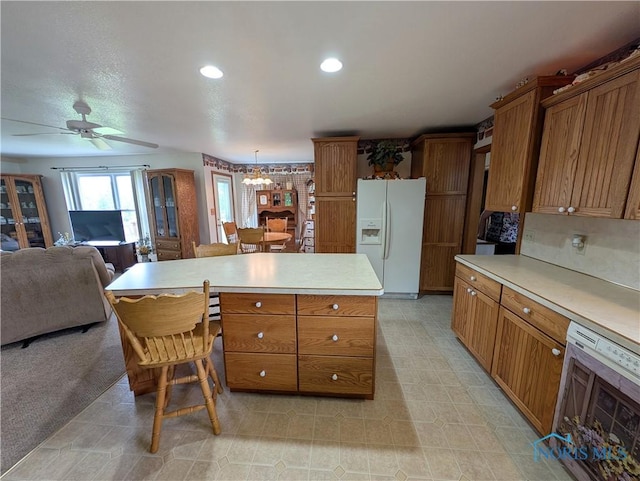 2450 N Billman Rd, Genoa, OH 43430 - kitchen featuring white fridge with ice dispenser, brown cabinetry, light countertops, wine cooler, and open floor plan