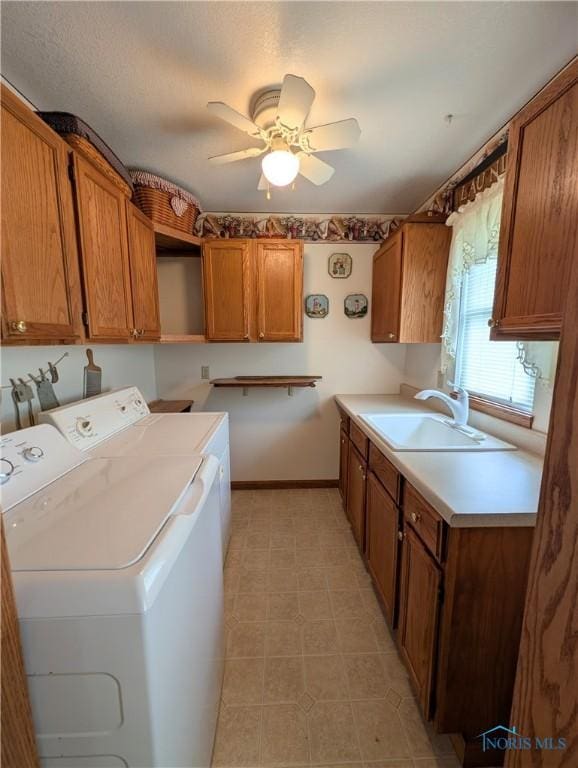 2450 N Billman Rd, Genoa, OH 43430 - laundry area featuring cabinet space, washer and clothes dryer, a ceiling fan, and baseboards