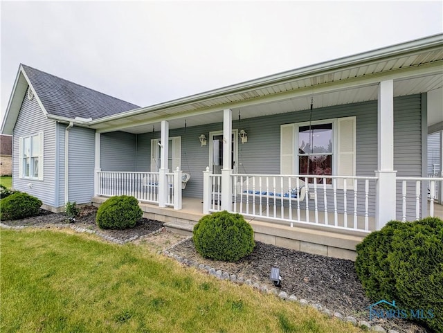 2450 N Billman Rd, Genoa, OH 43430 - view of front of house with a porch and a shingled roof