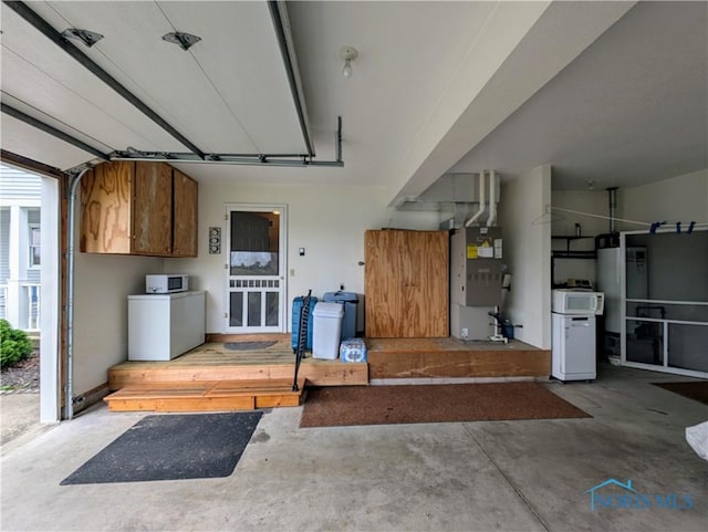 2450 N Billman Rd, Genoa, OH 43430 - garage with heating unit and water heater