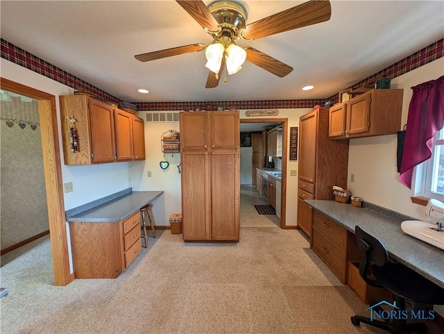 2450 N Billman Rd, Genoa, OH 43430 - kitchen with brown cabinetry, light colored carpet, ceiling fan, and recessed lighting