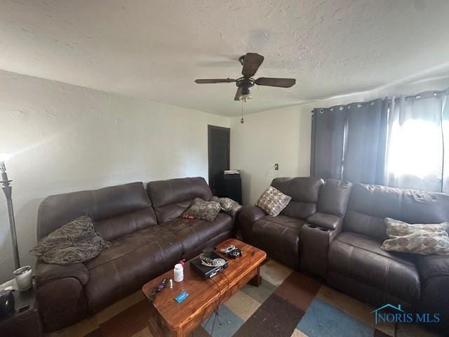 2111 Elm St, Toledo, OH 43608 - living room featuring ceiling fan and a textured ceiling