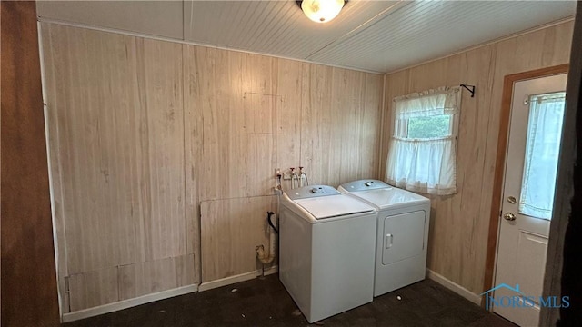 203 E Ash St, Continental, OH 45831 - laundry area with washer and clothes dryer, wooden walls, and baseboards