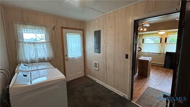 203 E Ash St, Continental, OH 45831 - laundry area featuring electric panel, baseboard heating, separate washer and dryer, wooden walls, and heating unit