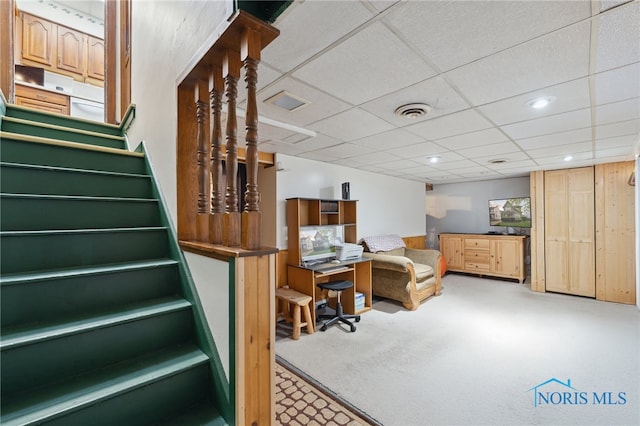 interior space featuring carpet floors, recessed lighting, and a drop ceiling