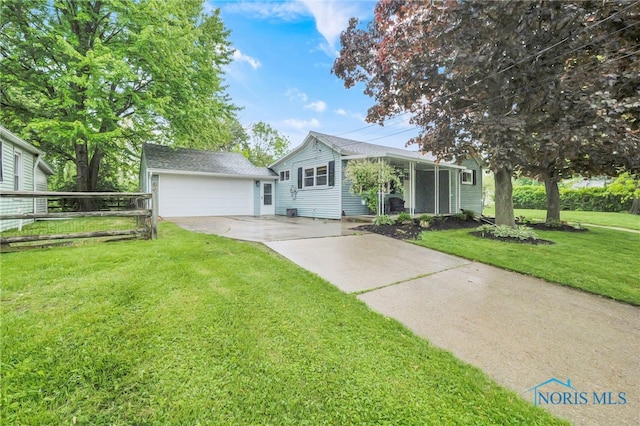 340 W 3rd St, Perrysburg, OH 43551 - view of front of house with a front lawn, a garage, and driveway