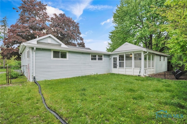 340 W 3rd St, Perrysburg, OH 43551 - rear view of house with a sunroom and a gate