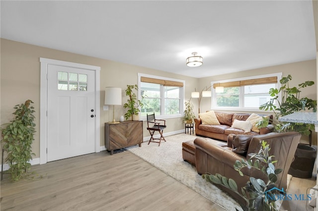 340 W 3rd St, Perrysburg, OH 43551 - living area featuring light wood-style flooring and baseboards