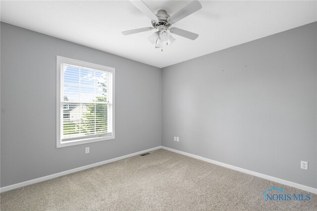 7060 Joannes Way, Maumee, OH 43537 - empty room featuring carpet floors, baseboards, and ceiling fan