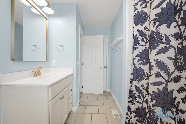 7060 Joannes Way, Maumee, OH 43537 - bathroom with vanity, tile patterned floors, a shower with curtain, and baseboards